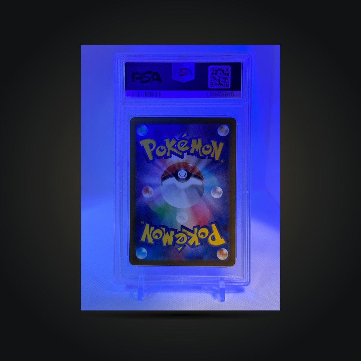 Pokémon Heat Wave Arena Cynthia's Roserade #065 PSA 10 (Japanese) — back of card in PSA holder under blue-purple lighting