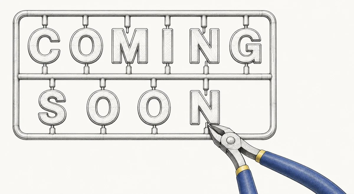 Nippers cutting the final letter from a Coming Soon model-kit sprue