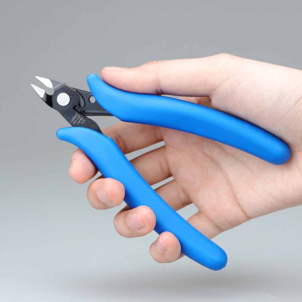 GodHand GH-PN-125 plastic model nipper held in one hand to show its grip and cutting head